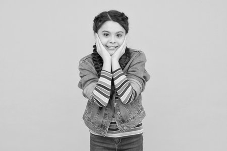 Your look, our care. Little child touch face skin. Skin care products. Skincare. Hair care cosmetics. Haircare. Childcare and pediatric health care. Beauty salon. When you look good you feel goodの写真素材