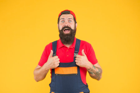 happy bearded man electrician repair and fix, carpenterの写真素材