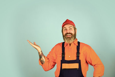 Man skillful worker. Electrician plumber handyman. Call master. Laborer. Repairman experienced worker. Construction worker. Fixing broken technics. Renovation concept. Mechanic perform technical workの写真素材