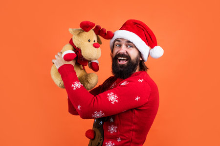 Remember these moments. bearded mature man wear knitted sweater with toy. ready for celebration....