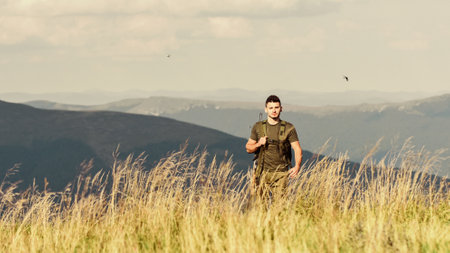 military style. male in camouflage. soldier in the field. polygon. army forces. sniper reach target...
