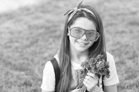 Gift delivery, satisfaction guarantee. Happy girl hold flower bunch. Shop floral gift. Holiday celebration. Birthday anniversary. Summer blossom. Gift shop. Make stunning gift for flower loverの写真素材