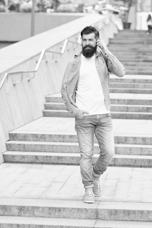 Let music take you away. Happy hipster listen to music urban outdoors. Bearded man wear headphones playing music. Casual fashion style. New technology. Modern life. Summer vacation. Dont stop musicの写真素材