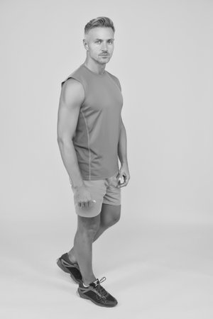 Muscular body. Good shape. Strong sportsman in gym clothes. Sportsman physically fit. Active sportsman. Health and healthy lifestyle. Sport and fitness. Training and workout. Mature and attractiveの写真素材