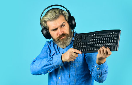 Cyber Championship. agile business. downloading music from internet. bearded man headphones and...