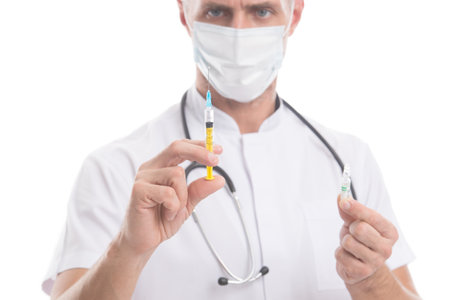 Paramedic hold ampoule syringe with covid-19 vaccine for coronavirus prevention, infection immunityの写真素材