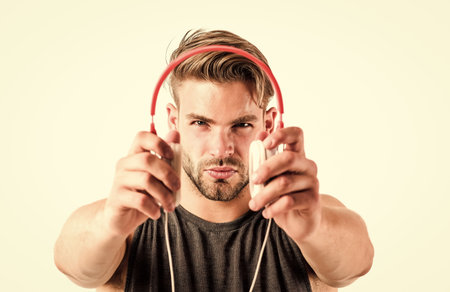 Equipment for dj. Man handsome guy using modern headphones. Music as daily therapy. Audio training for motivation. Listen music. Music taste. Professional software and devices. Entertainment conceptの写真素材
