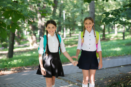 Educating little minds. Happy children back to school. School uniform. Formal fashion. Education and schooling. Knowledge day. Startup. September 1. Nurturing futuresの写真素材