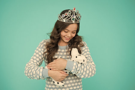 Kid girl delighted gift. Happy childhood. Pedigree dog. Exclusive and unique. Pets care. Vet shopping. Celebrate birthday. Kid love birthday gift. Feeling grateful for gift. Surprise and presentの写真素材