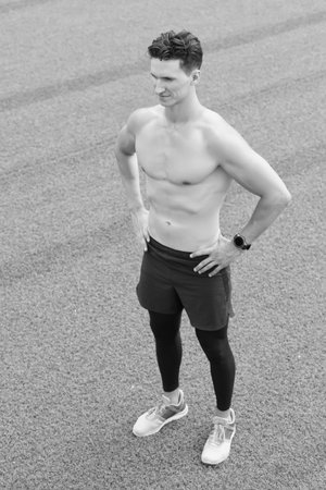 Confident young fitness man with strong hands. Strong Athletic Man. Fitness Model with Torso showing six pack or abs. naked athlete with strong body. dedicated to fitnessの写真素材