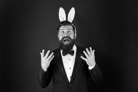 Pleasure to come. Happy boss celebrate Easter. Businessman wear rabbit ears. Happy holiday celebration. Spring celebration and tradition. Springtime. Easter day celebration. Enjoying celebrationの写真素材