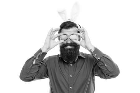 Looking for Easter goods. Celebration of spring holiday. Bearded man with bunny ears and Easter...