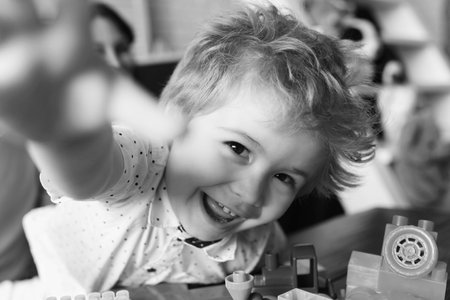 Joy and games concept. Child with cheerful faceの写真素材