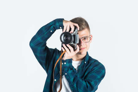 teen boy wear casual shirt with retro photo camera isolated n white, photographerの写真素材