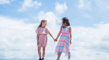 pretty teen girl with long hair in dress, fashionの写真素材