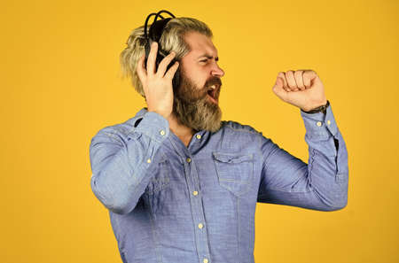 future singer. good mood playlist. Man with headset. bearded man hipster in headset. listen audio book. Music beat for energetic mood. his favorite song. enjoy excellent sound song in earphonesの写真素材