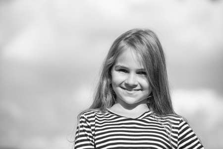 Smile with confidence. Happy kid smile on cloudy sky. Small child with cute smile. Teeth health....