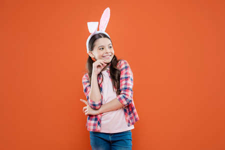 happy child girl in easter bunny ears having fun, happy easterの写真素材