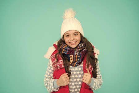 kid warm knitwear. Trendy and stylish. Portrait of smiling girl hipster. Youth street fashion....