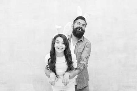Dad and daughter bunny ears. Father and child celebrate easter. Better together. Spring holiday....