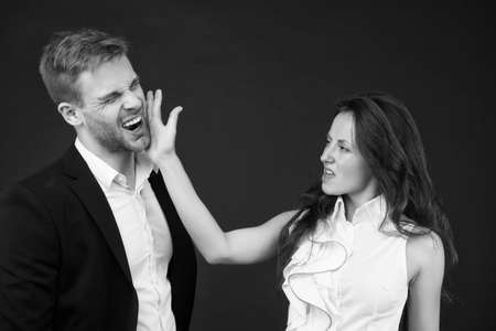 Abuse at work. Angry woman slap man in face. Using physical abuse in workplace. Physical harm....