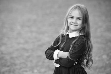 Back to school and looking cool. Happy kid back to school. Small girl wear school uniform. Dress code. Formal education. Startup. September 1. Back to school in style, copy spaceの写真素材