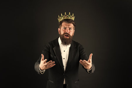 Business success concept. King of style. Best man on Earth. Achieving business success. Royal and luxury. Handsome worker. Glory seeking man. Power and triumph. Business king. Businessman wear crownの写真素材