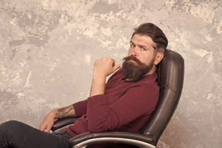 Professional and skilled. Serious businessman. Businessman relax in office chair. Bearded businessman wear business casual. Brutal look of businessman with hipster beard and mustache. Barber shopの写真素材