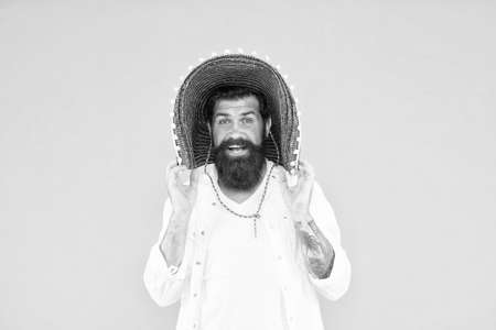 Guy cheerful festive mood at party. Summer festival. National holidays. Mexican hat sombrero. Guy happy festive outfit. Spanish costume. Mexican celebration. Travel to mexico. Man in mexican hatの写真素材