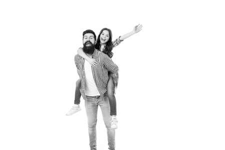 My father is super. Father carry daughter piggyback. Little child and father have fun together. Happy family in photo studio. Fathers day. Enjoy time and funny activities. My father is my friendの写真素材