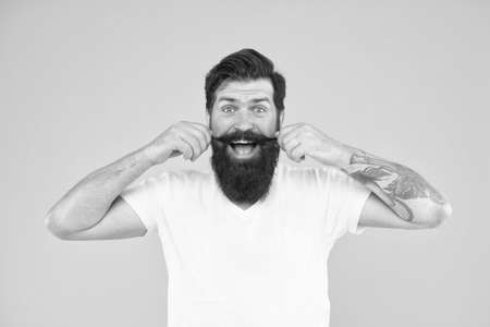 Handsome man mustache twirl barbershop services, playful mood conceptの写真素材