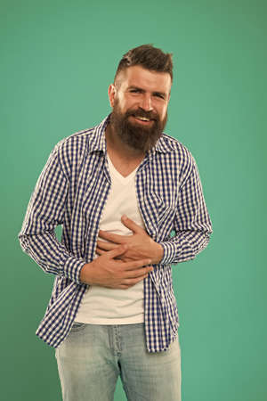 Laughing all the day. Carefree natural emotion. Caucasian man isolated on blue background laughing happy. Happy man with big smile. Handsome guy with beard happy face. Sense of humor. Stomach painの写真素材