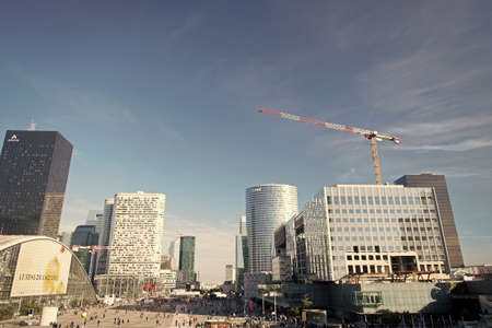 Paris, France - September 29, 2017: esplanade in La Defense district. Modern glass architecture. Architectural tourist attraction. Highrise construction building. Business nad commercial districtのeditorial素材