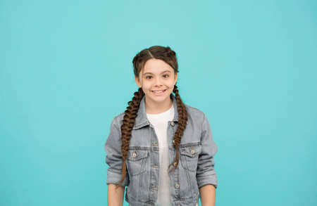 Be your own kind of beautiful. Happy child smile blue background. Little child in casual style. Fashion trend. Trendy style. Beauty look. Child care and childhood. International childrens dayの写真素材