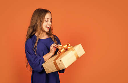 Birthday gift. Spread love around. Mothers day recognizes mothers motherhood and maternal bonds. Girl hold gift box. Little child celebrate traditional holiday with present. Buy gift. Shopping onlineの写真素材