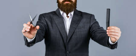 Enjoying morning routine. Master grooming hair and beard in barbershop. hairdresser makes hairstyle....