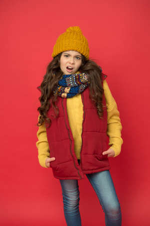 Winter holidays. winter holiday activity. child in knitted hat and scarf feel cozy. wearing...