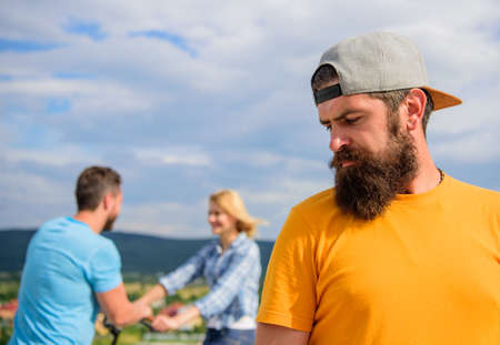 Man hipster feels lonely couple dating behind him. Unlucky romantic life. Guy adult still lonely...