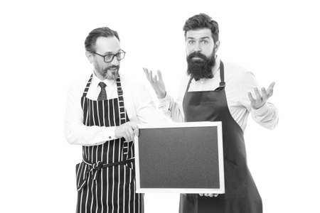 catering business. welcome on board. cafe and restaurant opening. menu planning. happy chef team in apron. partners celebrate start up. bearded men with blackboard, copy space. Right nutritionの写真素材