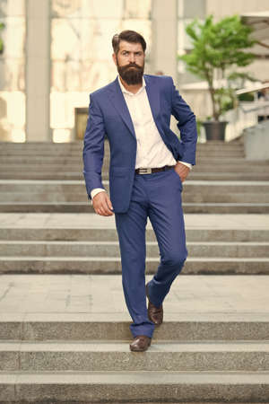 Business people. On his way to success. Walking down street. Mature hipster with beard on stairs. Bearded man in business centre. Confident brutal man walk street. Businessman in formal clothesの写真素材