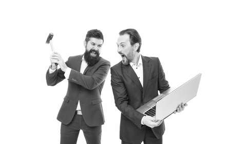 Service for gadgets. Repair service. Men with laptop and hammer. Breakdown and malfunction. Lags annoy them. Internet connection failure. Computer service concept. Business problems. Online lifeの写真素材