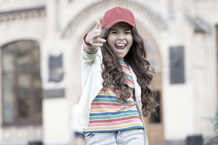 Girl living happy life. Positive concept. Happy expression. Celebrate childrens day. Summer vacation. Smiling girl. Cheerful schoolgirl. Happy smiling child. Have fun. Emotional happy kid outdoorsの写真素材