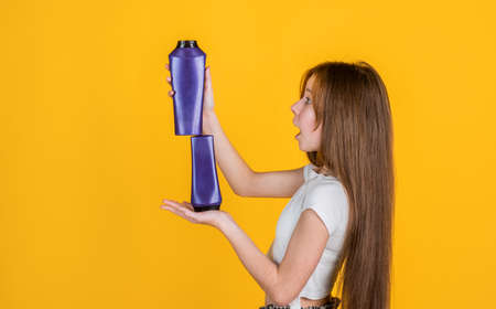 teen girl wash long straight hair with shampoo and condirioner, beauty salonの写真素材