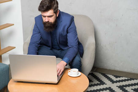 To join in the Internet revolution you need to open a laptop. Businessman working on laptop....