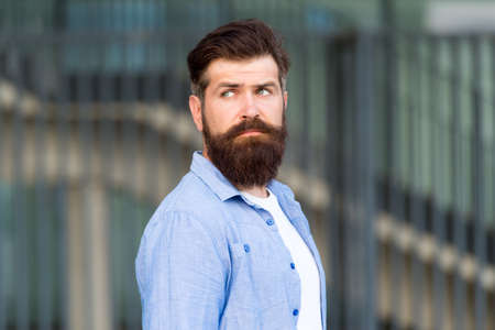 Declare your style. serious bearded man. handsome brutal man. Hair and beard care. Male barber care. brutal caucasian hipster with moustache. bearded man outdoor. Mature hipster with beardの写真素材