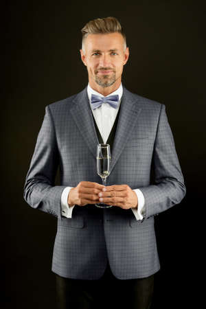 Sincere congratulations. Businessman drink sparkling wine. Celebrate success. Champagne toast. Champagne cheers. Man in suit corporate party. Boss director hold glass champagne. Business celebrationの写真素材