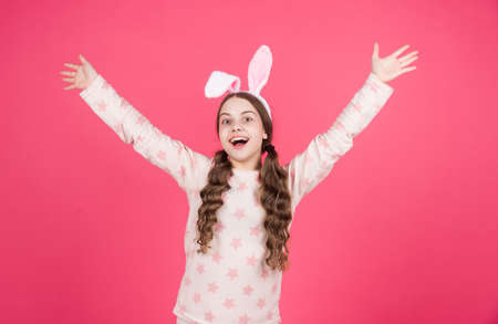 positive emotions. childhood happiness. child in rabbit ears and pajamas. time for fun. adorable kidの写真素材