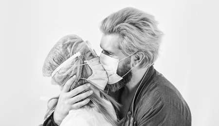 nurse woman kiss patient. avoid personal contact. pandemic outbreak preventions. stay at home. man and doctor in respirator mask. Couple in love. protect your family. quarantineの写真素材