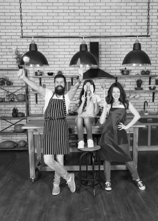 Happy family cooking holiday meals together, having fun conceptの写真素材