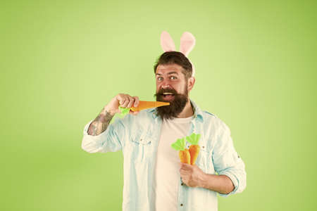 Spring is coming. Buy vegetables. Organic farm. Easter holiday. Easter bunny with carrot. Man long...